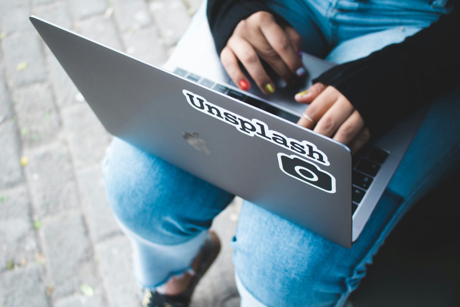 person holding gray laptop